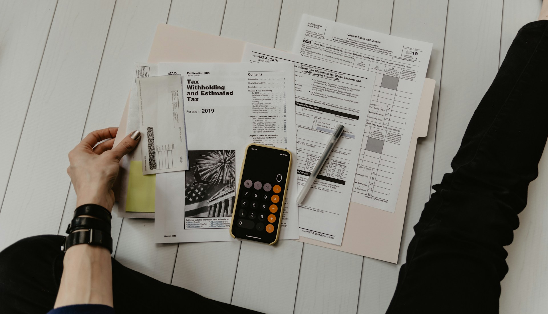 UAE corporate tax filing documents on a desk representing the AED 3 million annual revenue threshold test for Small Business Relief and the cumulative multi-year eligibility requirement