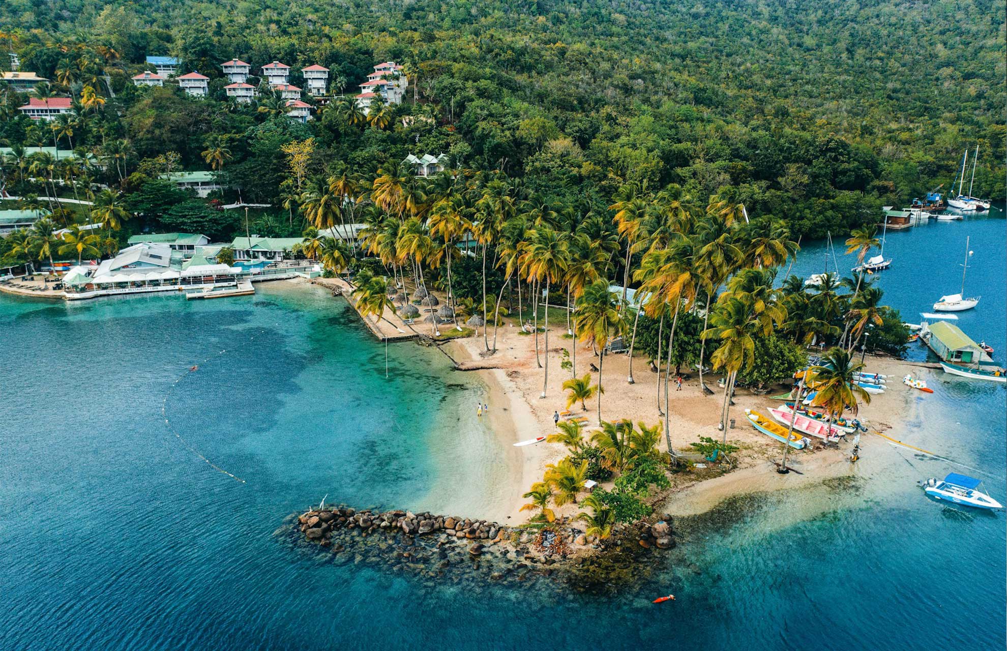 Caribbean island aerial view representing offshore jurisdictions including Nevis, BVI and Cayman Islands where beneficial ownership registers remain confidential within FATF-compliant frameworks in 2026